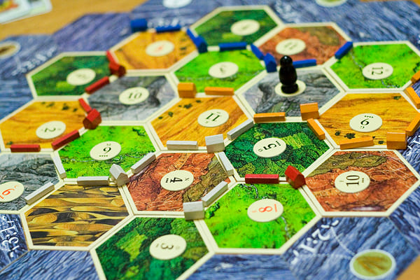 Settlers of Catan board with hex tiles and settlements